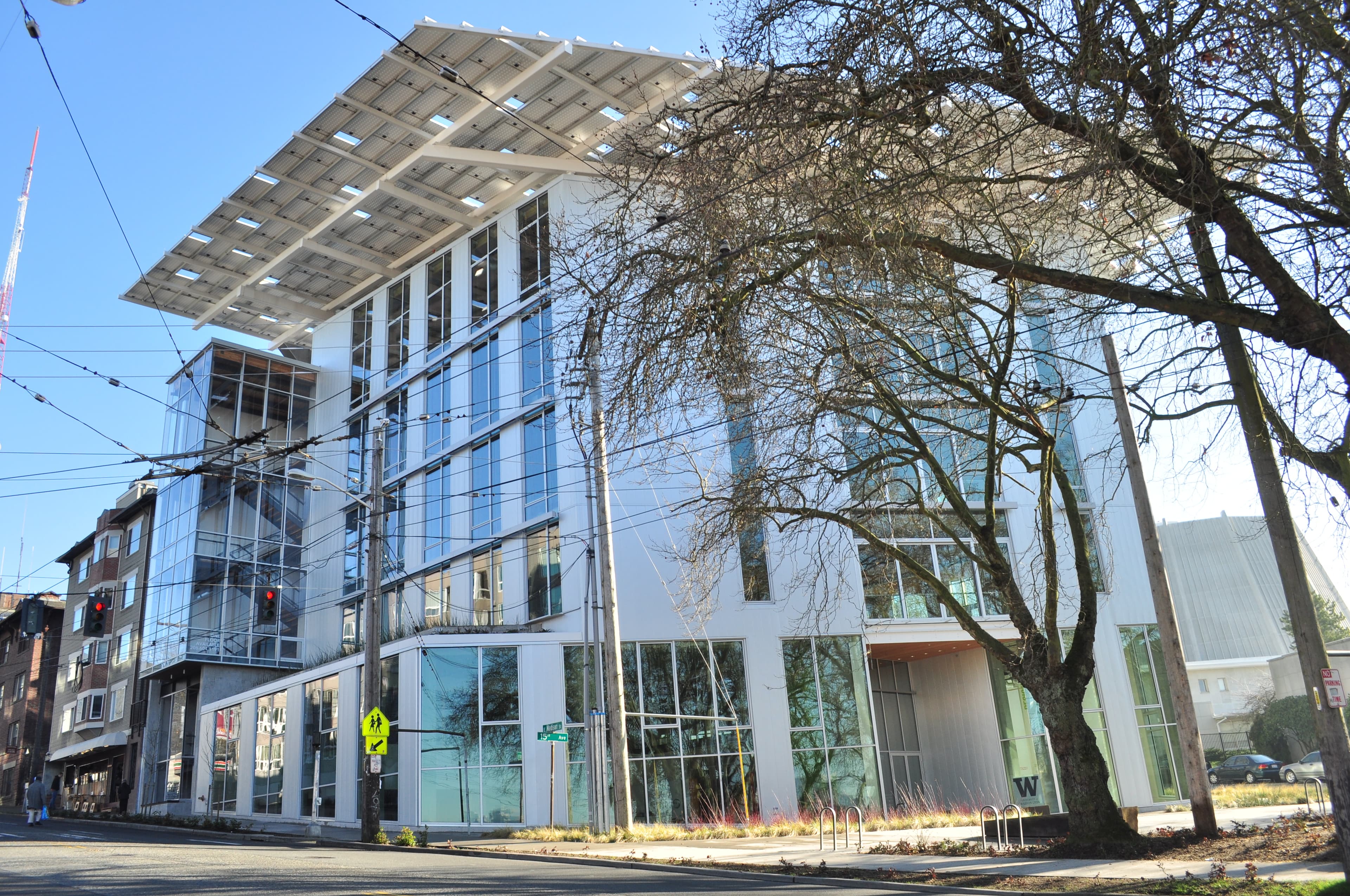 The Bullitt Center in Seattle with its broad roof canopy and glass stair tower.